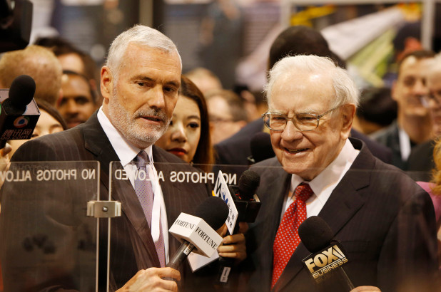 Warren Buffett, right, talks with Mark Donegan, CEO of Precision Castparts, at the Precision Castparts booth in exhibit hall during the Berkshire Hathaway Annual Shareholders Meeting at the CenturyLink Center in Omaha, Nebraska on April 30, 2016.