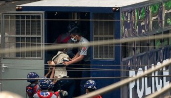 Police arrest a man in Yangon on Saturday, after a crackdown on demonstrations by protesters against the military coup.SAI AUNG MAIN / AFP - Getty Images